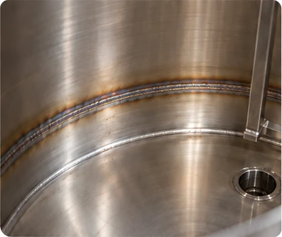 Internal stainless steel tank weld with localised heat discolouration.